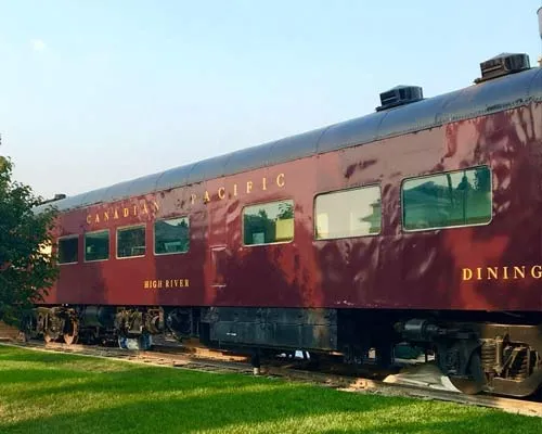 The Whistlestop Cafe’s red Canadian Pacific dining car beside the Museum of the Highwood